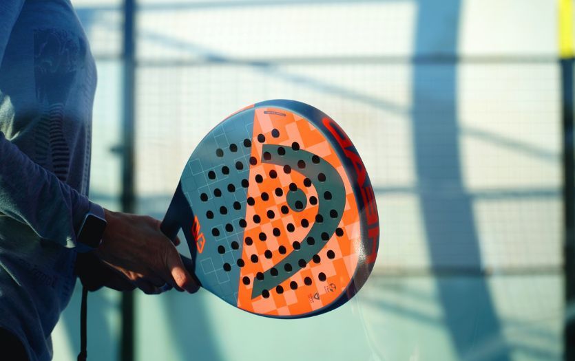 A padel racket in the game.