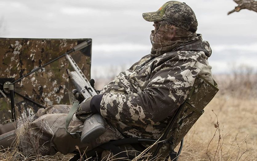 A turkey hunter waiting patiently behind his blind