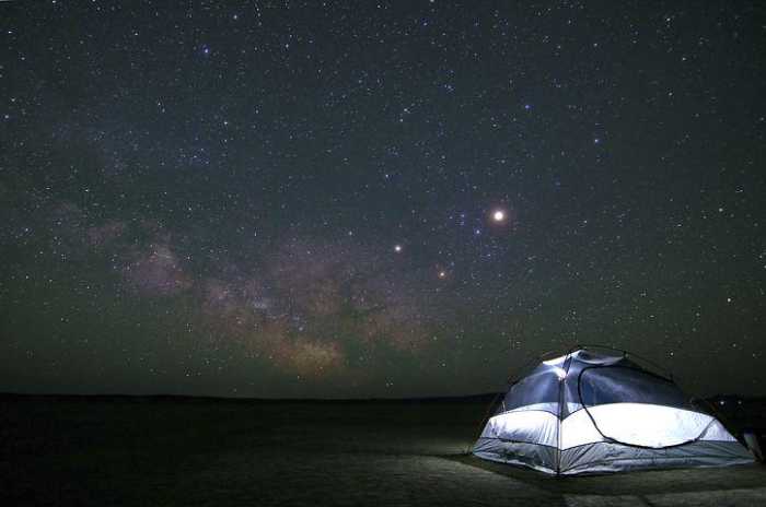 An illuminated Pop Up Camping Tent