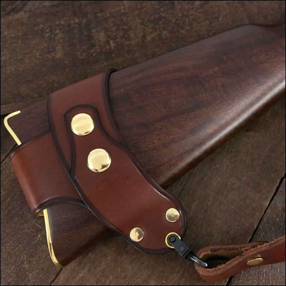 custom leather sling looped around the buttstock of a rifle